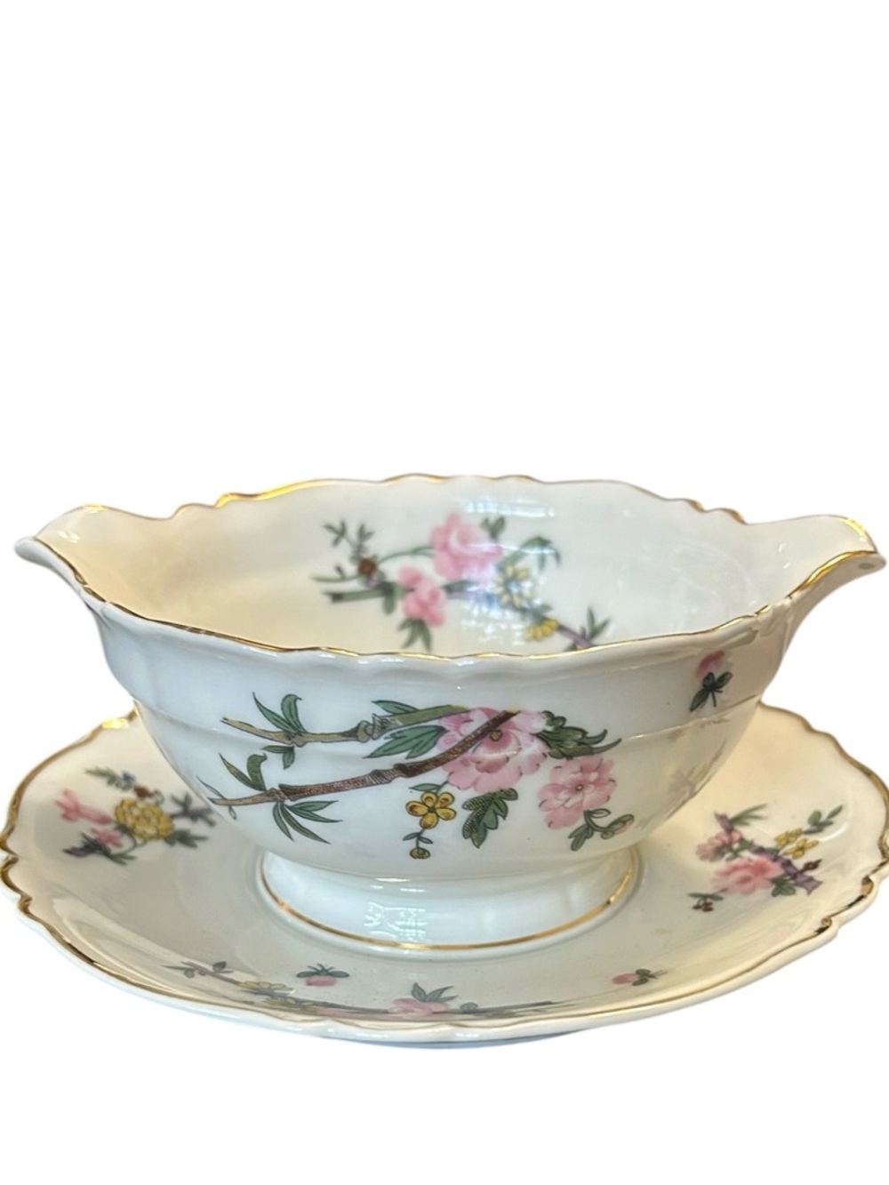 vintage Limoges French porcelain gravy boat with an attached underplate.